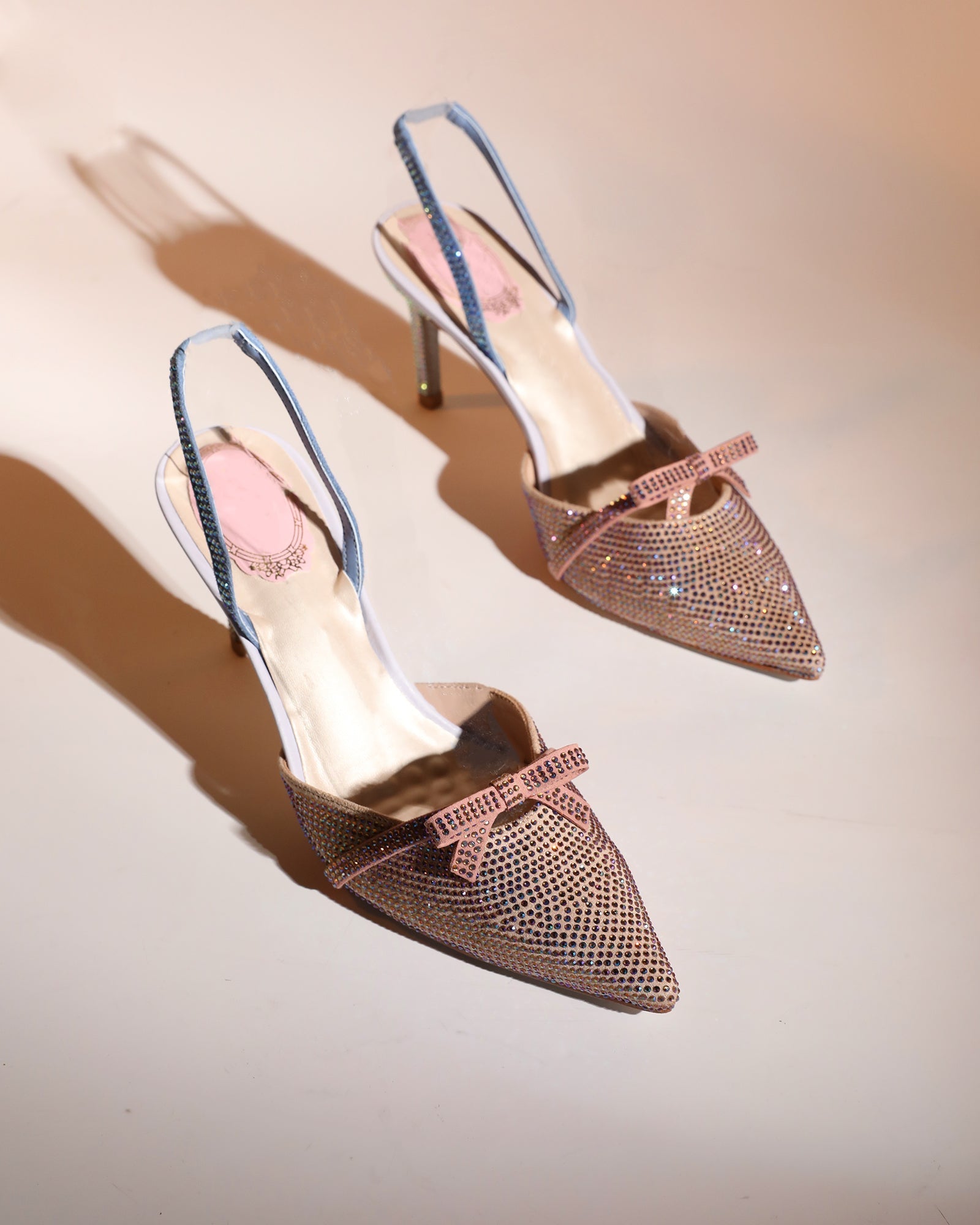 Easton Bow Rhinestone Slingback Pumps In Champagne